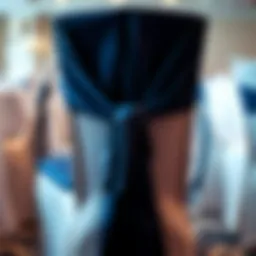Elegant navy blue chair sash draping over a banquet chair