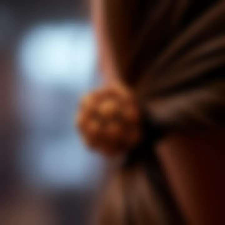 Close-up of a stylish ponytail holder showcasing intricate ball designs