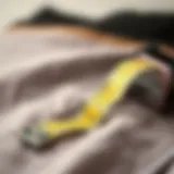 Close-up view of a retractable cloth tape measure on a fabric